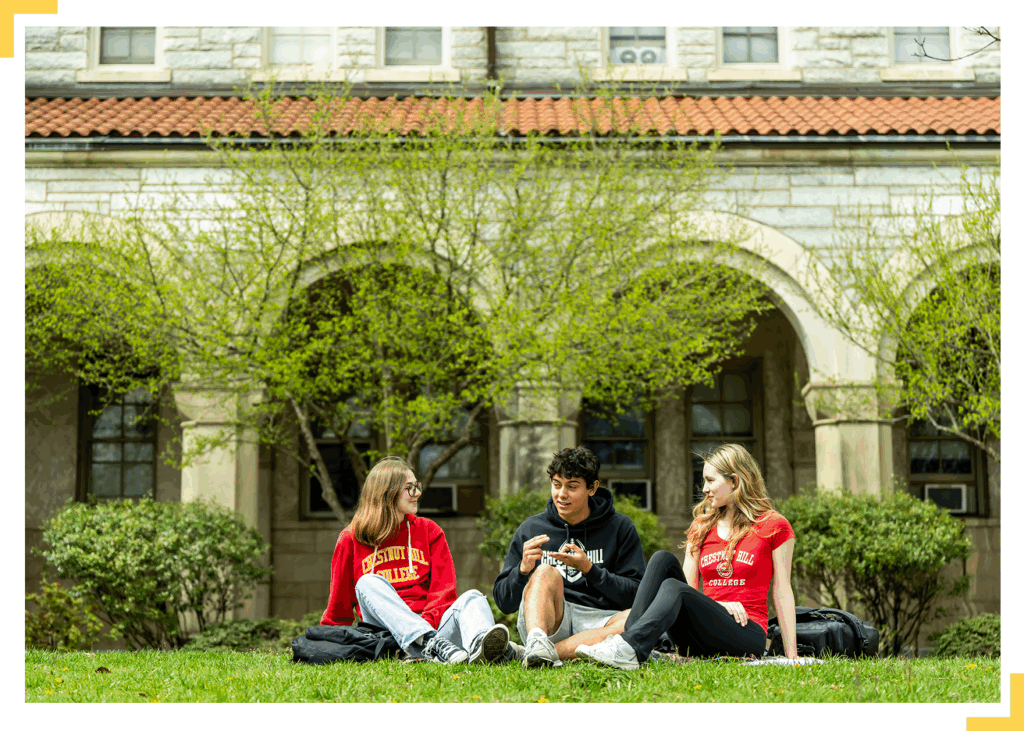 group of students on campus lawn in campus gear